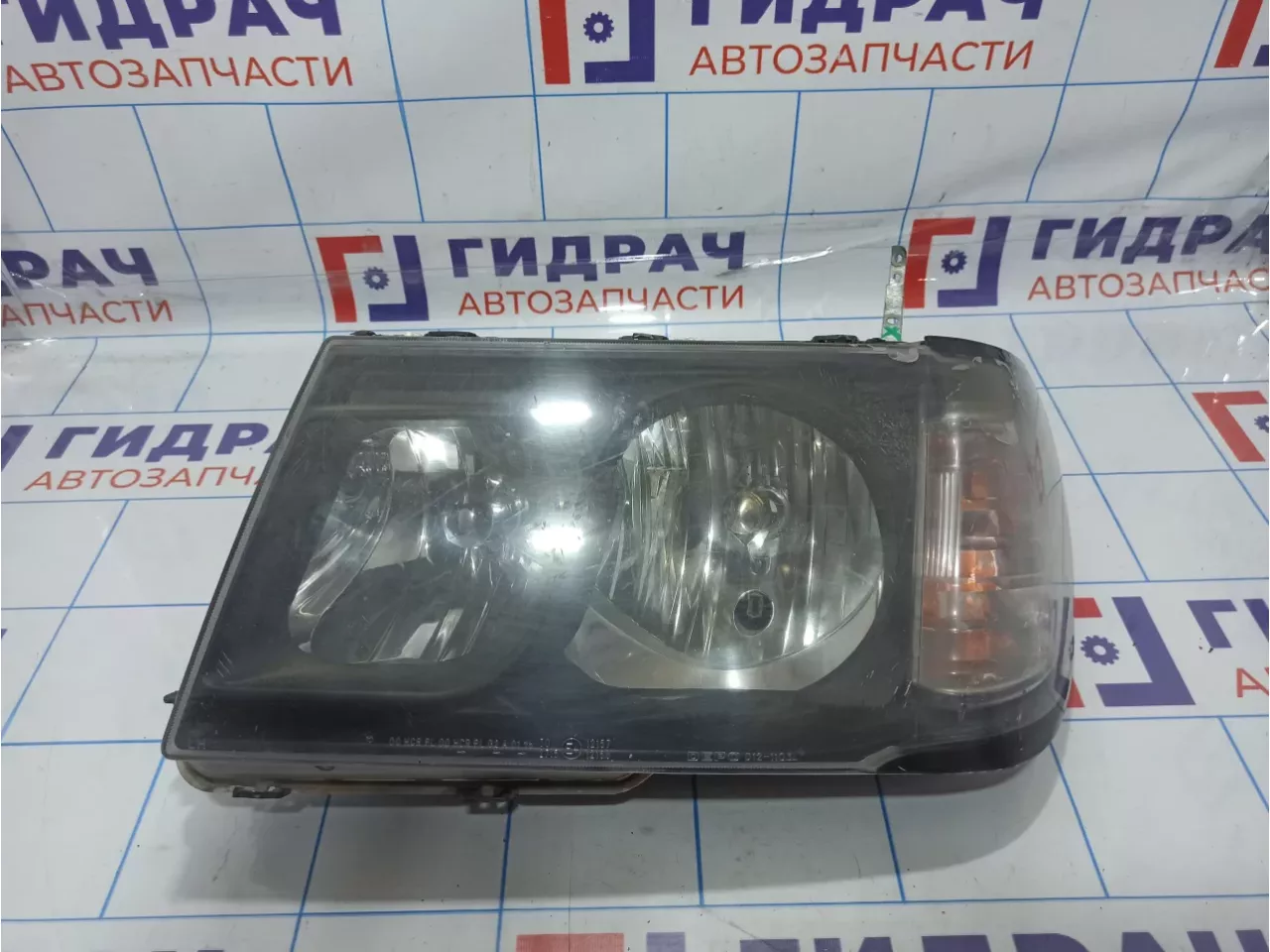 Фара левая Toyota Land Cruiser (J100) 81050-60070